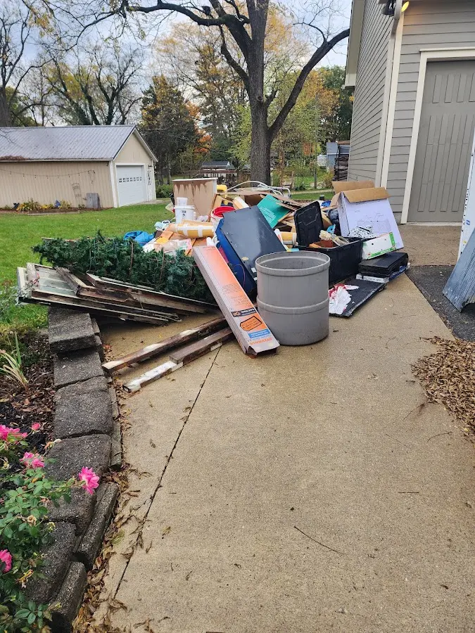 Dumpster being loaded with debris for 30 Yard Dumpster Rental in Braselton